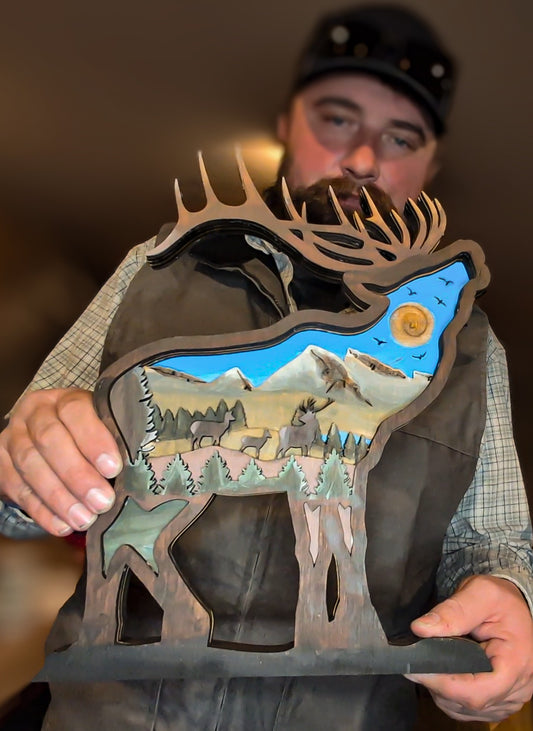 Workshop Participant with Painted and Finished 3D Layered Elk