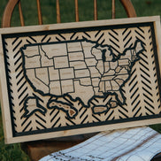 Full view of the Hearthline Series wooden USA travel map displayed on a rustic wooden chair, ideal for wall décor and memory tracking.