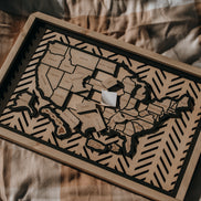 Hearthline Series wooden USA map showing peel-and-stick state pieces ready to place, designed for tracking travel memories one state at a time.